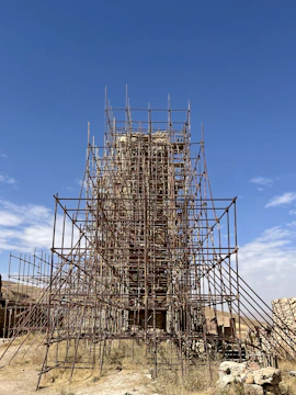 Historic monument site surrounded by scaffolding during renovation.