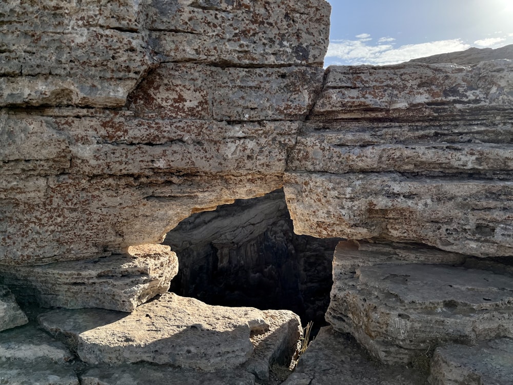 a rocky outcropping with a hole in the middle