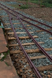 a train track with a stop sign on top of it