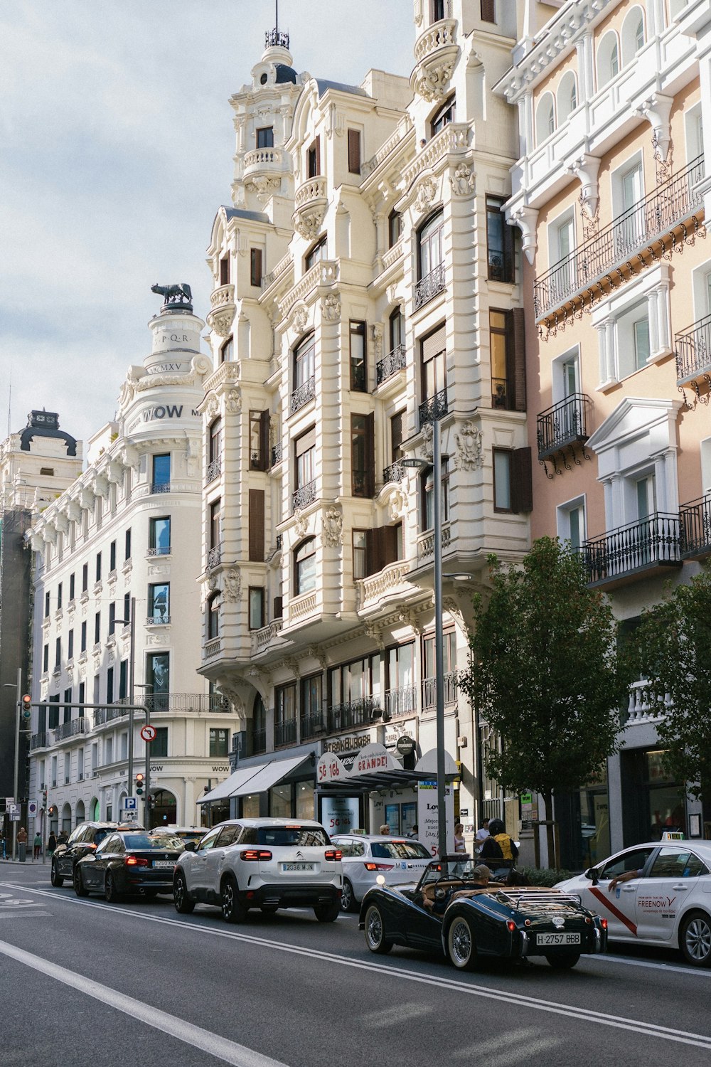 a city street filled with lots of tall buildings