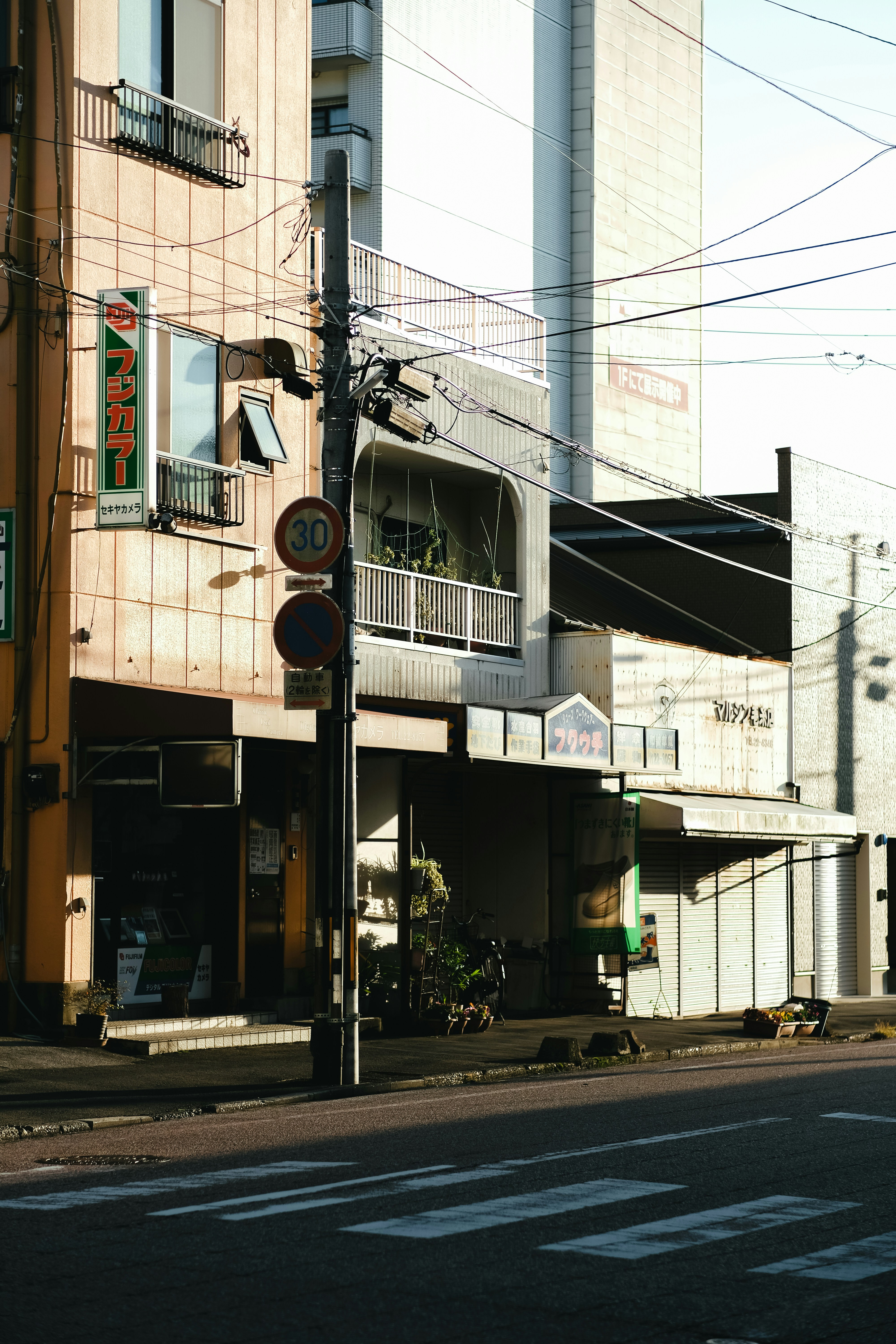 a street corner with a building on the corner