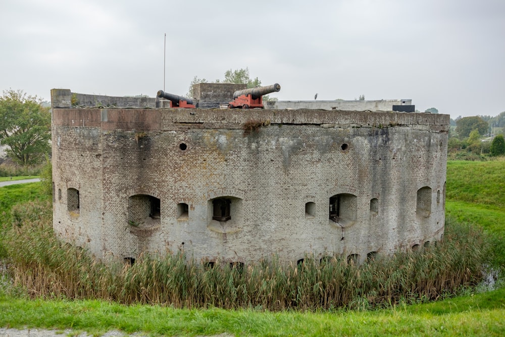 a round building with a tank on top of it