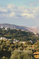 Wide shot of rolling hills with plots marked for Baja California land projects.
