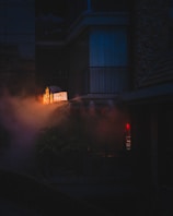 An atmospheric in-game scene showing the interior of the gun shop under moody lighting.