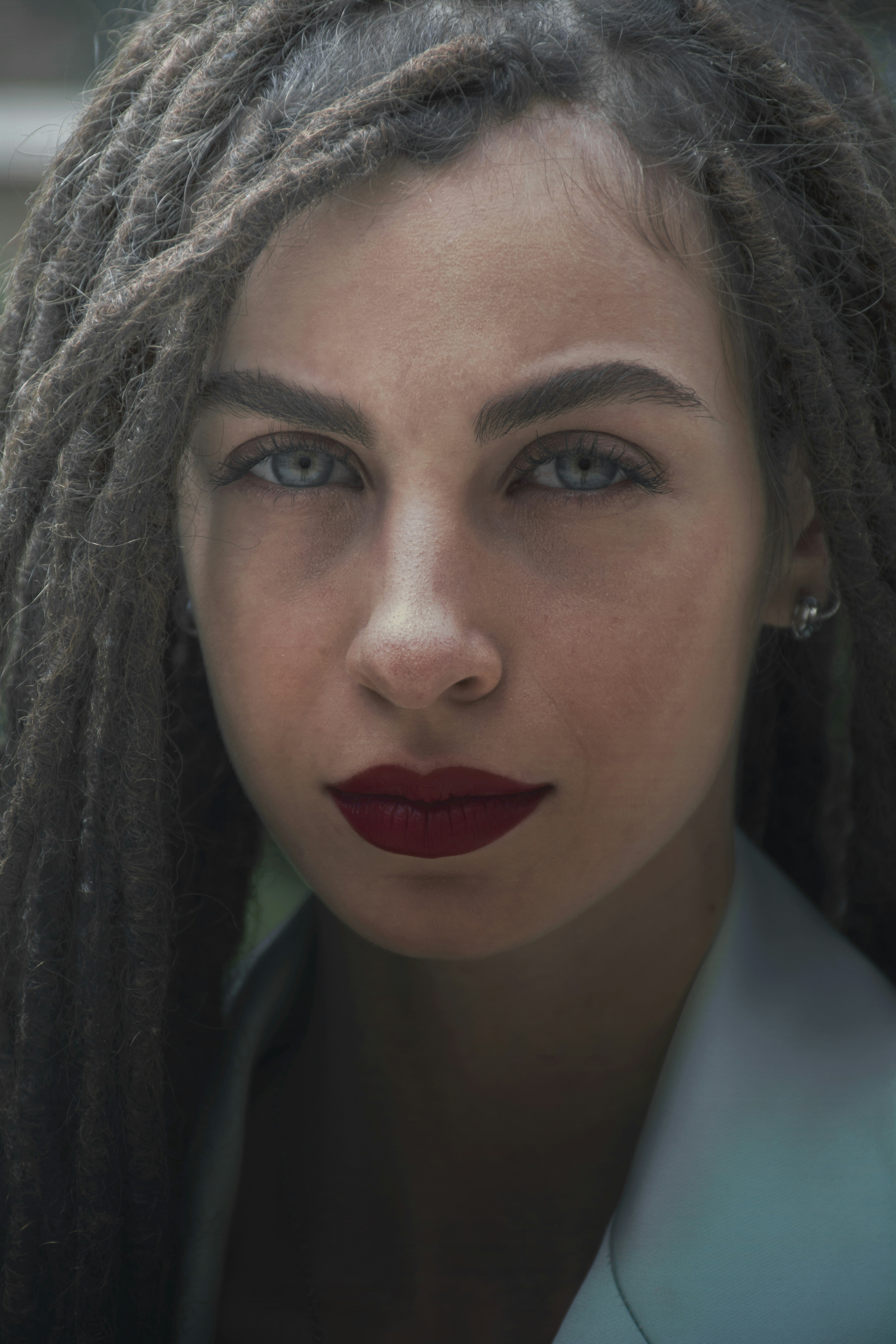 woman wearing yellow long-sleeved dress under white clouds and blue sky during daytime