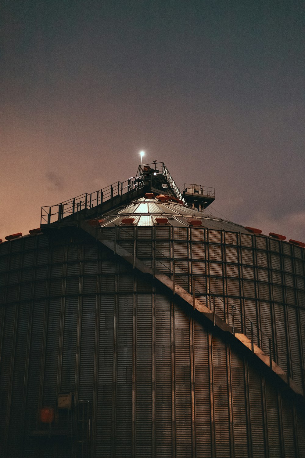 a large metal structure with a sky background