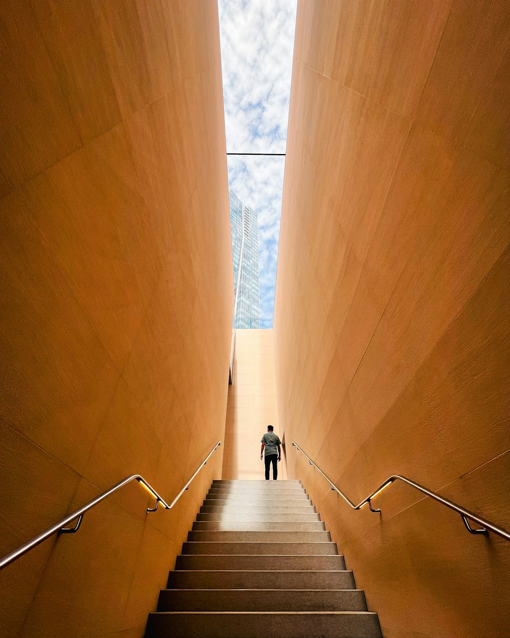 a man walking up a flight of stairs