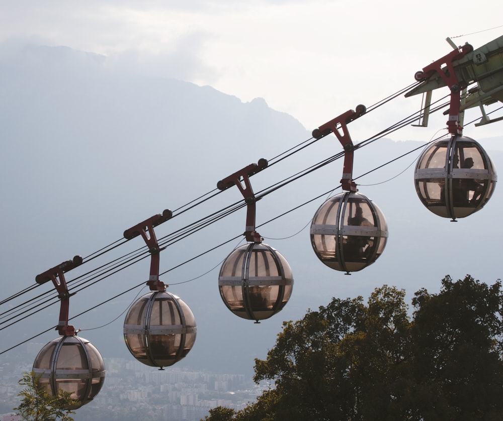 a bunch of gondola hanging from a wire