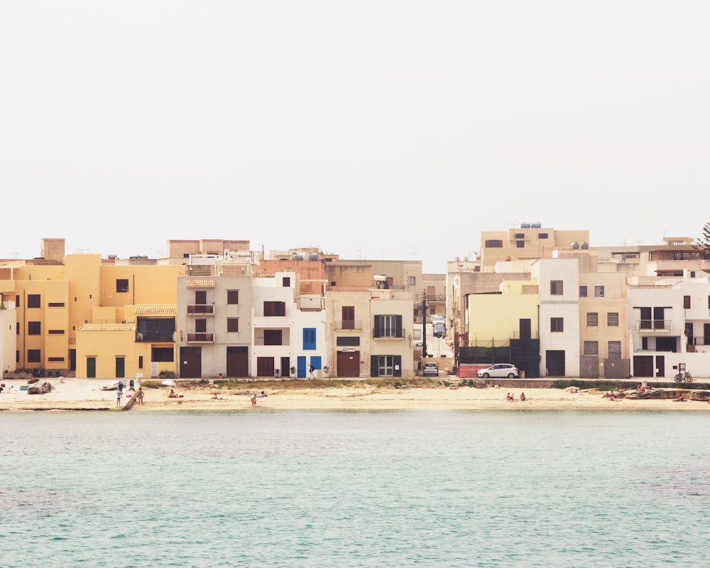 a body of water with a bunch of buildings in the background