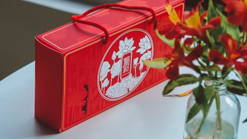 A vibrant flower bouquet arranged inside a vintage Indian post box.