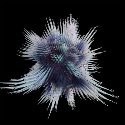 A complex, abstract 3D structure with numerous elongated, spiky projections radiating outward. The spikes have subtle gradients of colors, including shades of purple, blue, and white, all against a black background.