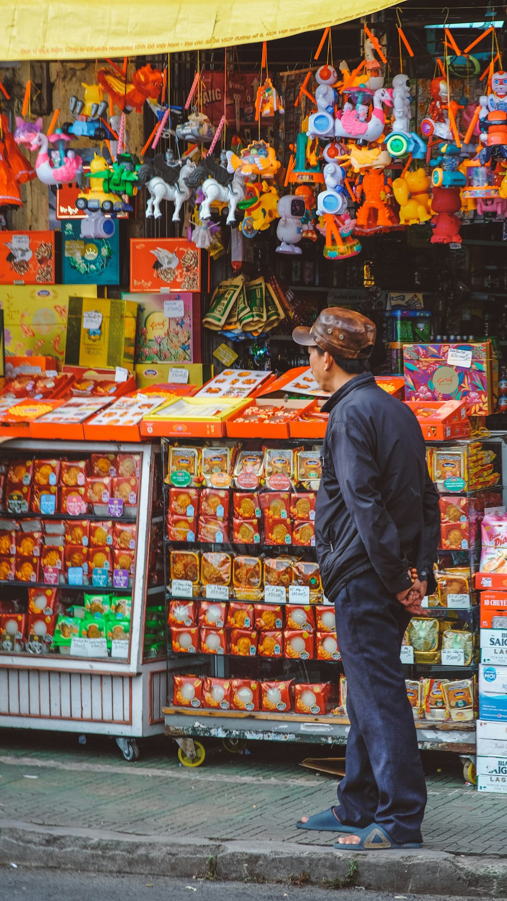 a man is standing in front of a store