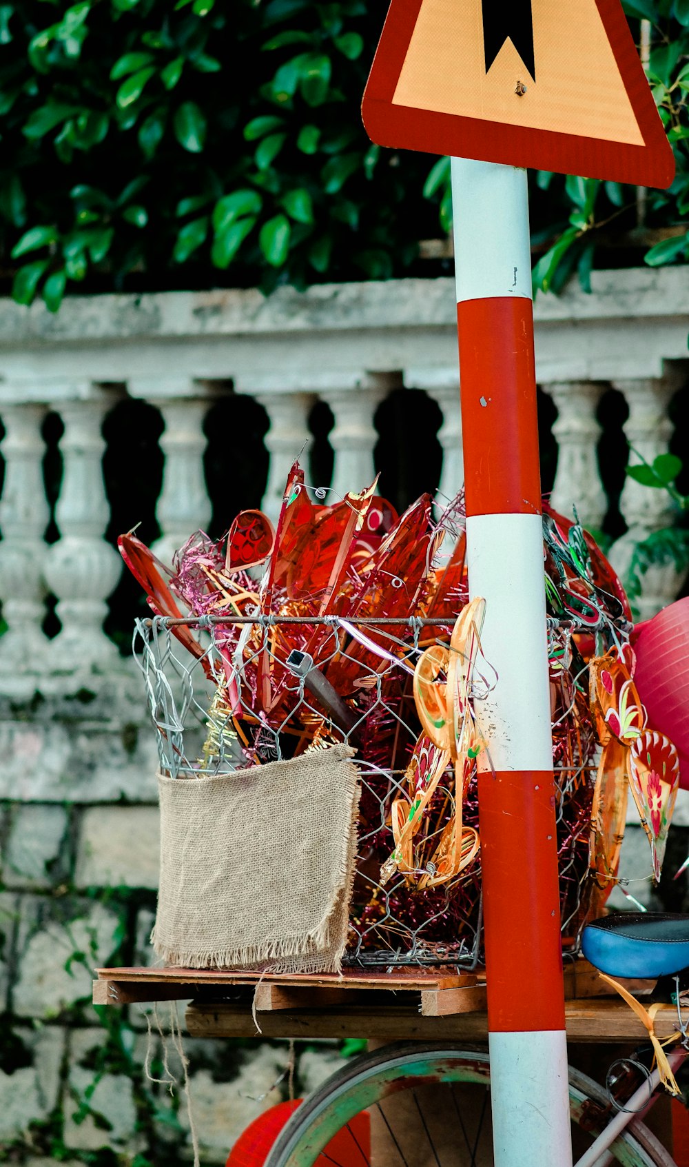 a red and white traffic sign sitting on top of a wooden table