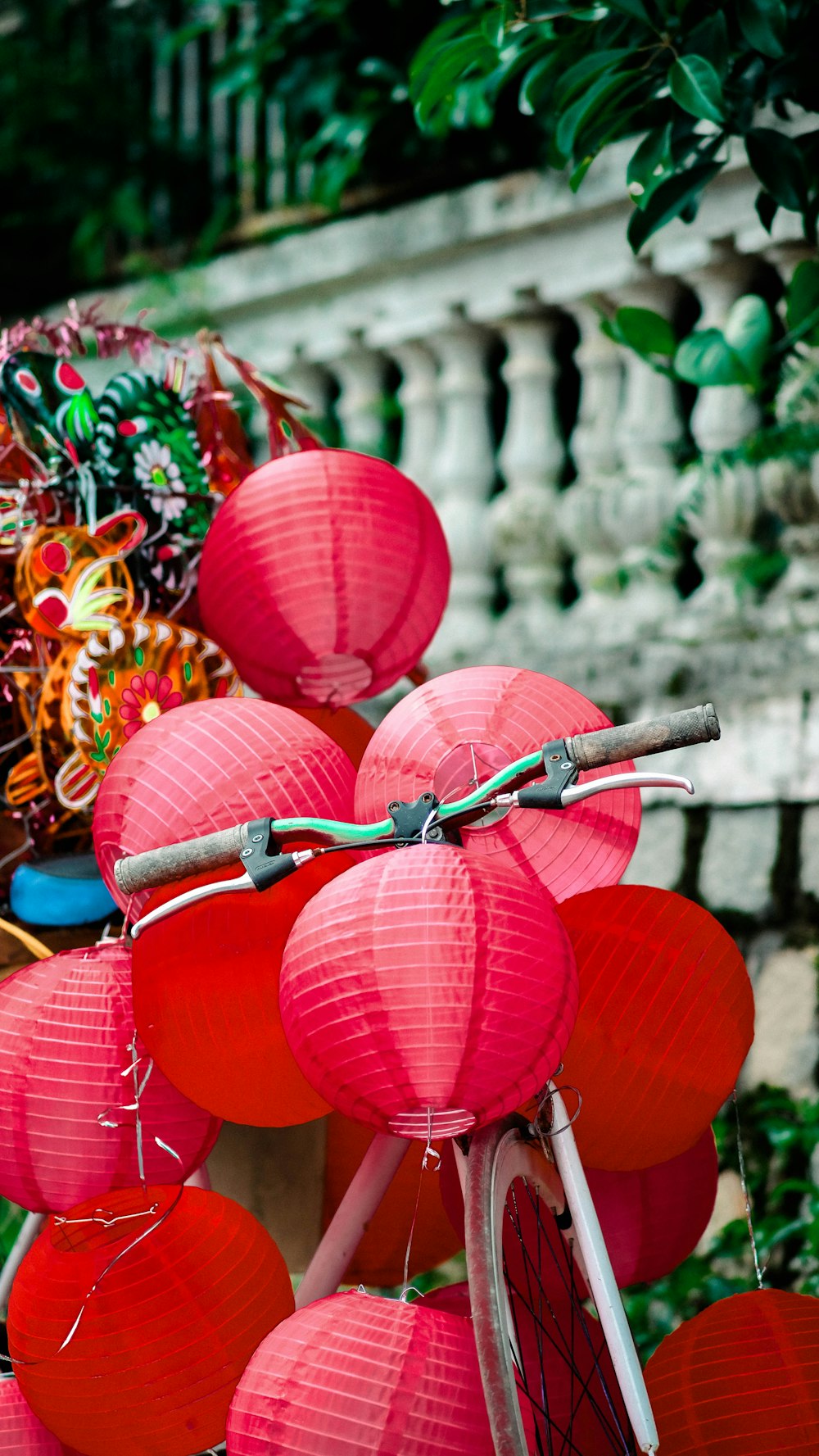 a bicycle with red lanterns attached to it