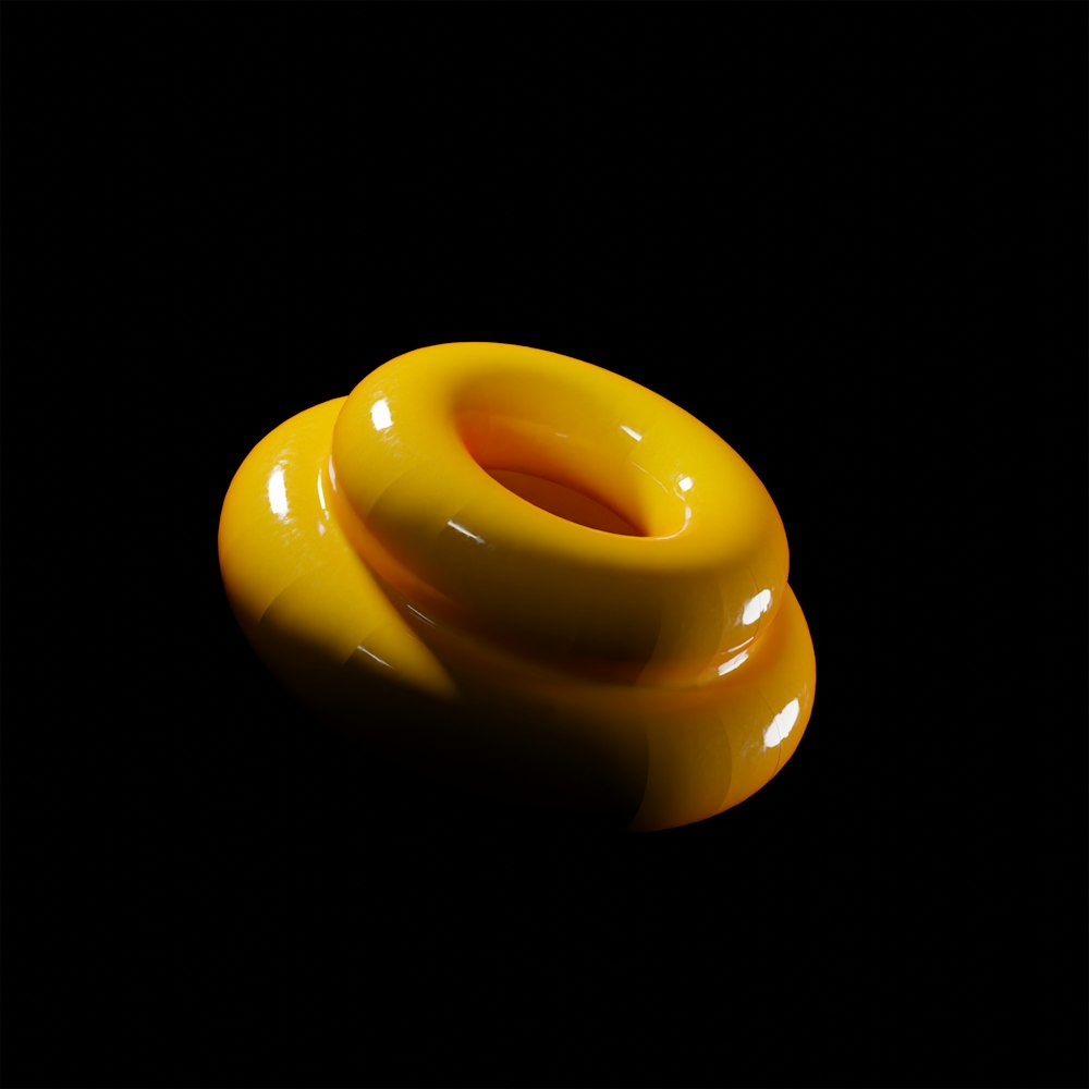 a yellow object on a black background