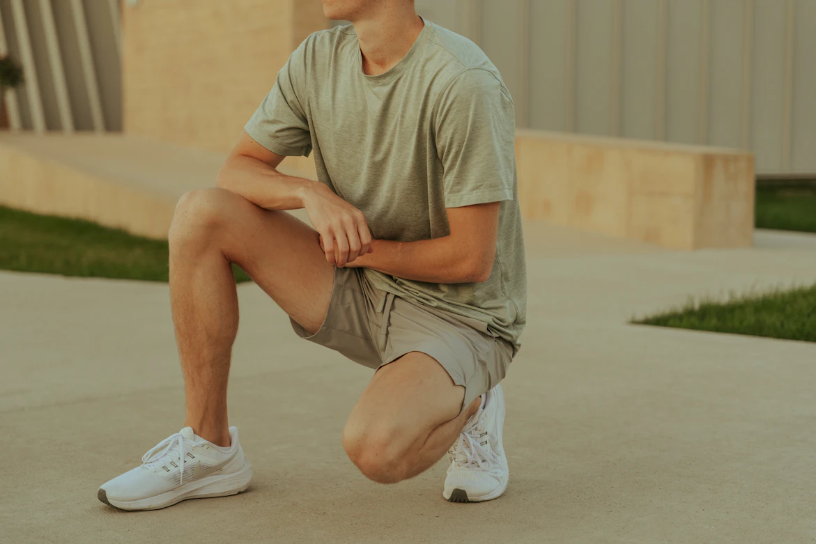 Khaki stretch shorts on model