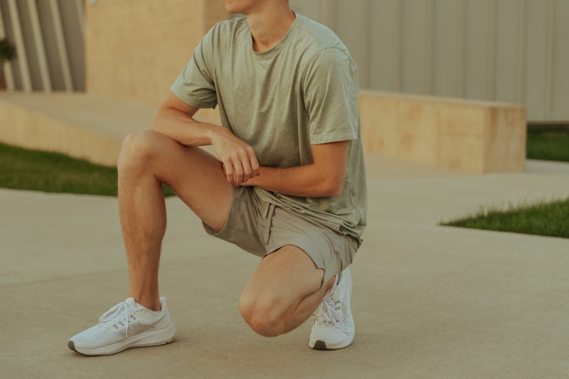 Chilled man seated on pavement