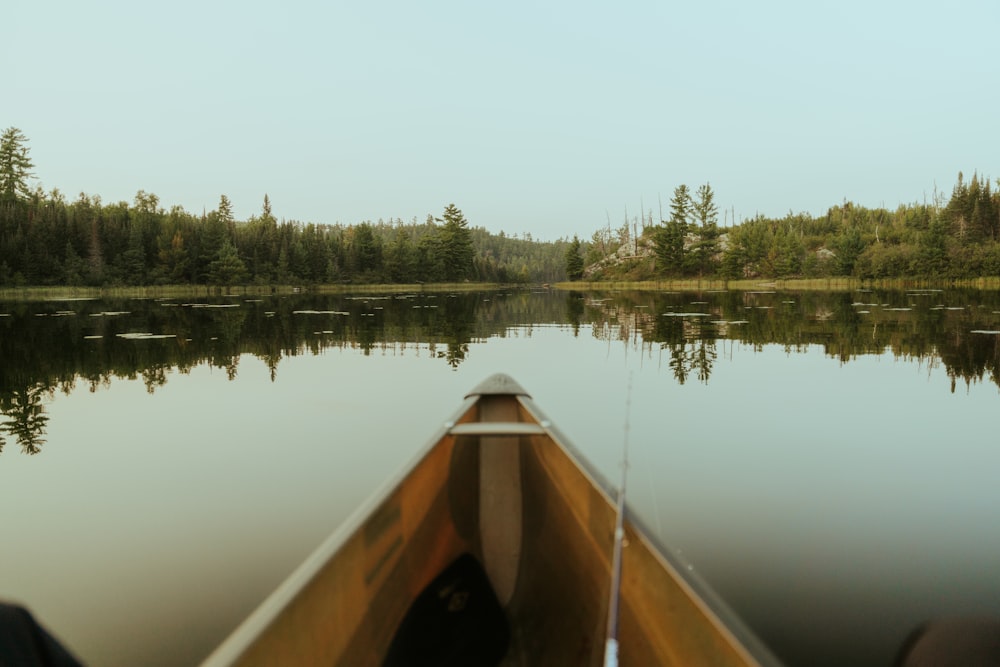 a person in a canoe on a calm lake