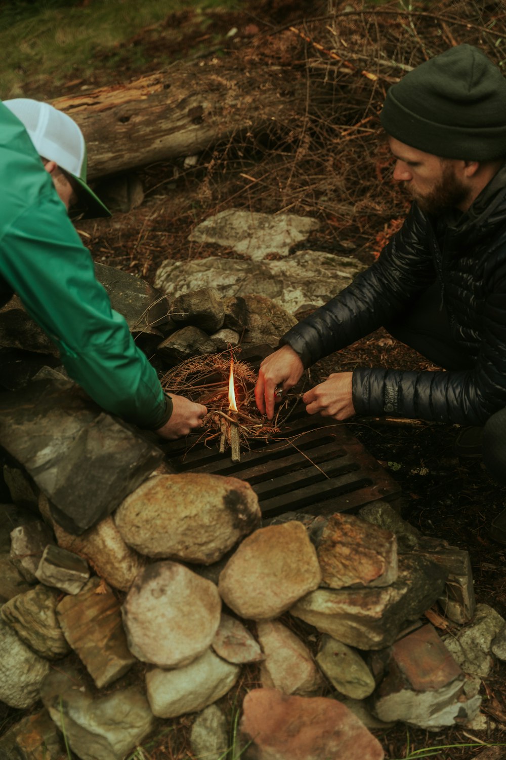 a man and a woman lighting a candle together