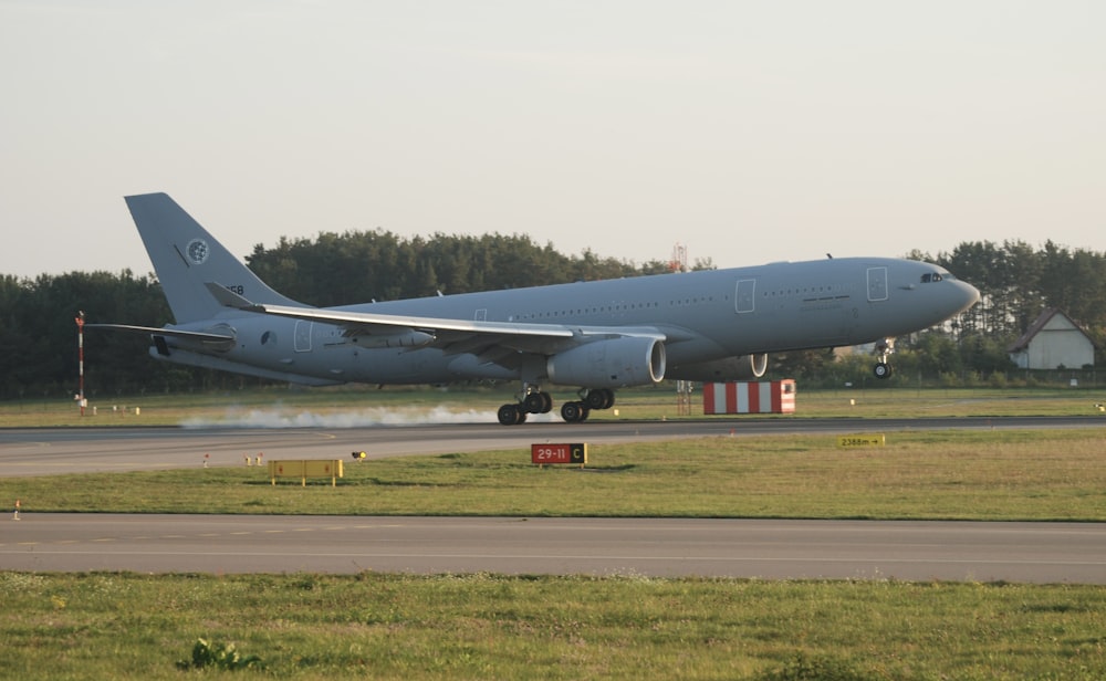 a large jetliner taking off from an airport runway