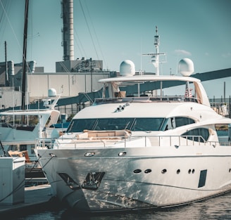 a large white boat docked at a dock