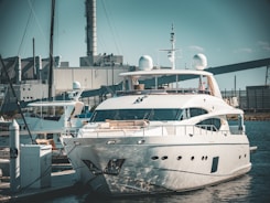 A marine surveyor inspecting a luxury yacht docked at Valencia port
