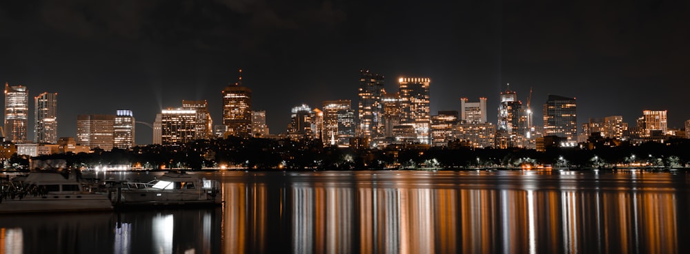 a city skyline is lit up at night