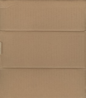 A brown cardboard box, closed and laid flat, with visible creases and slight shadows indicating the box's structure with its intersecting flaps.