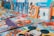 An assortment of colorful children's books arranged on a surface. The books feature popular animated characters and themes, with prominent illustrations on their covers.
