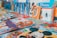 An assortment of colorful children's books arranged on a surface. The books feature popular animated characters and themes, with prominent illustrations on their covers.