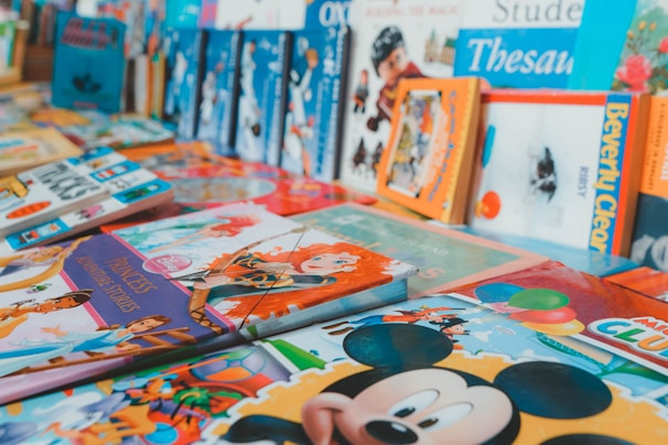 A stack of illustrated children's storybooks with bright, inviting covers