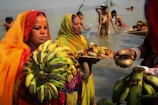 Saffron-clad devotees performing rituals at Saptashrungi Mata temple.