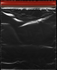 A transparent plastic zipper storage bag with a red and yellow sealing stripe at the top. The bag appears shiny under light, showing reflections and creases in the material.