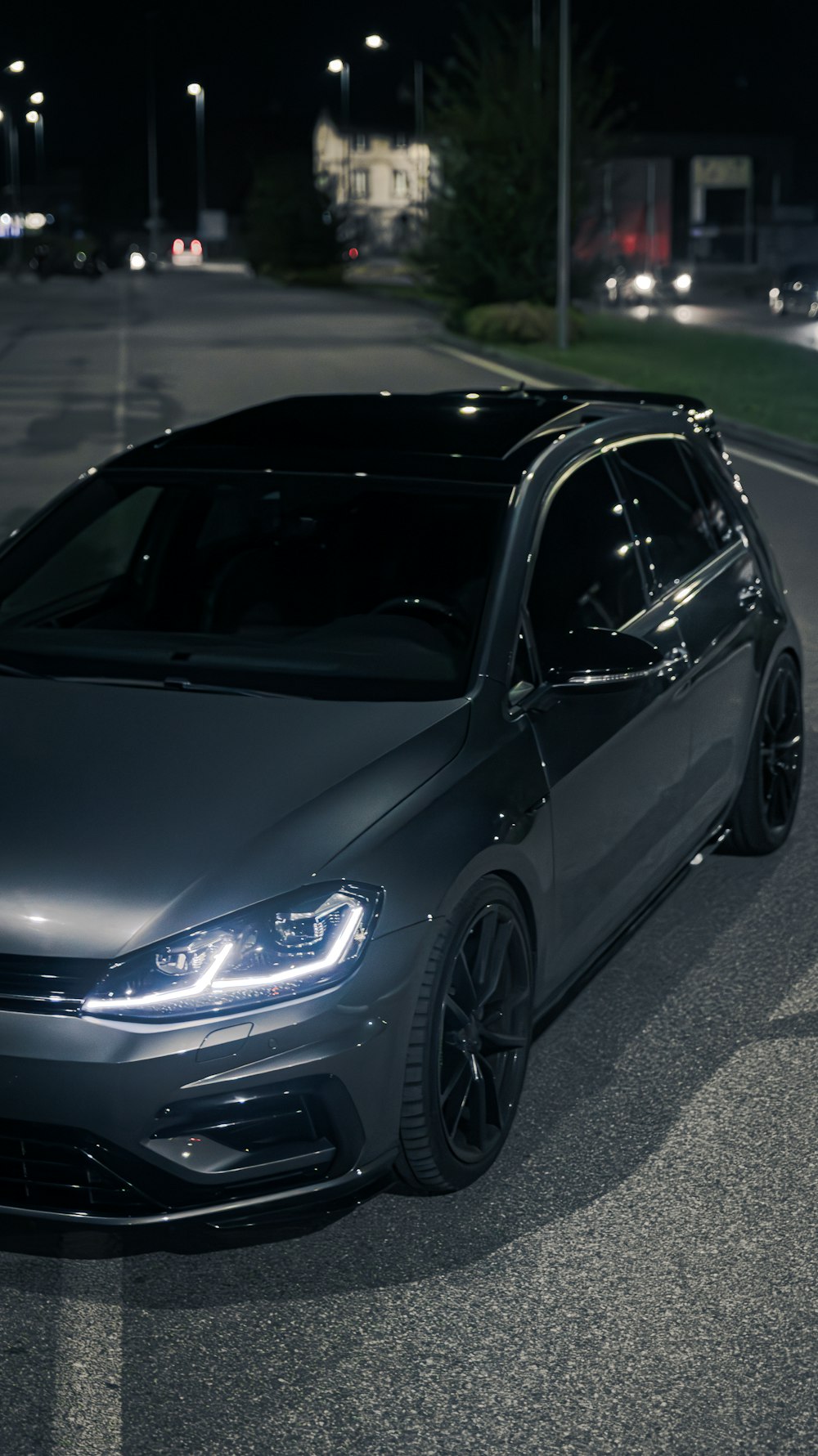 a car parked in a parking lot at night