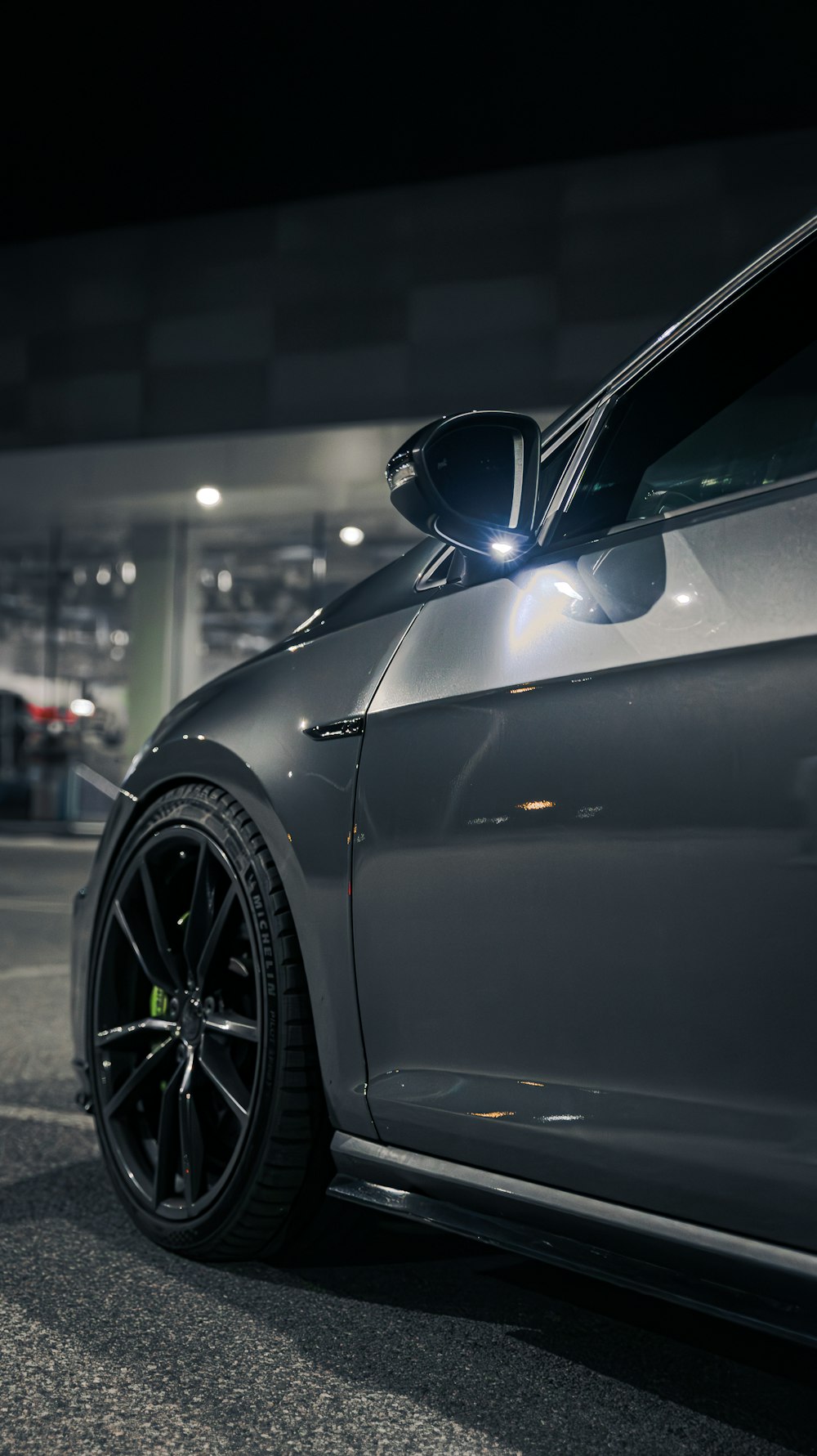 a car parked in a parking lot at night