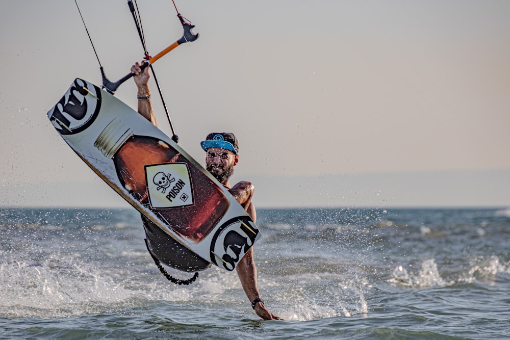 a man riding a wind sail on top of a body of water