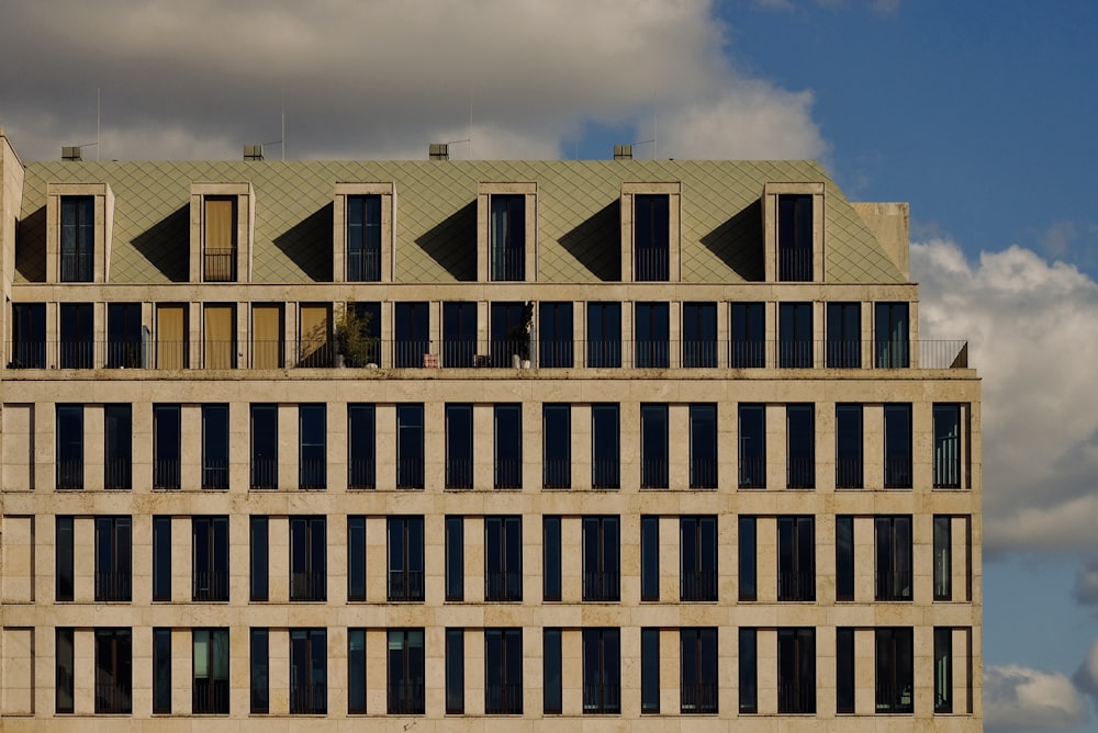 a tall building with lots of windows on top of it