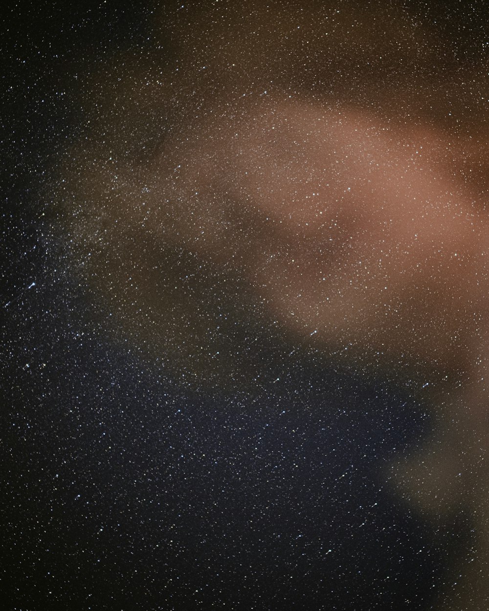 a blurry image of the night sky with stars