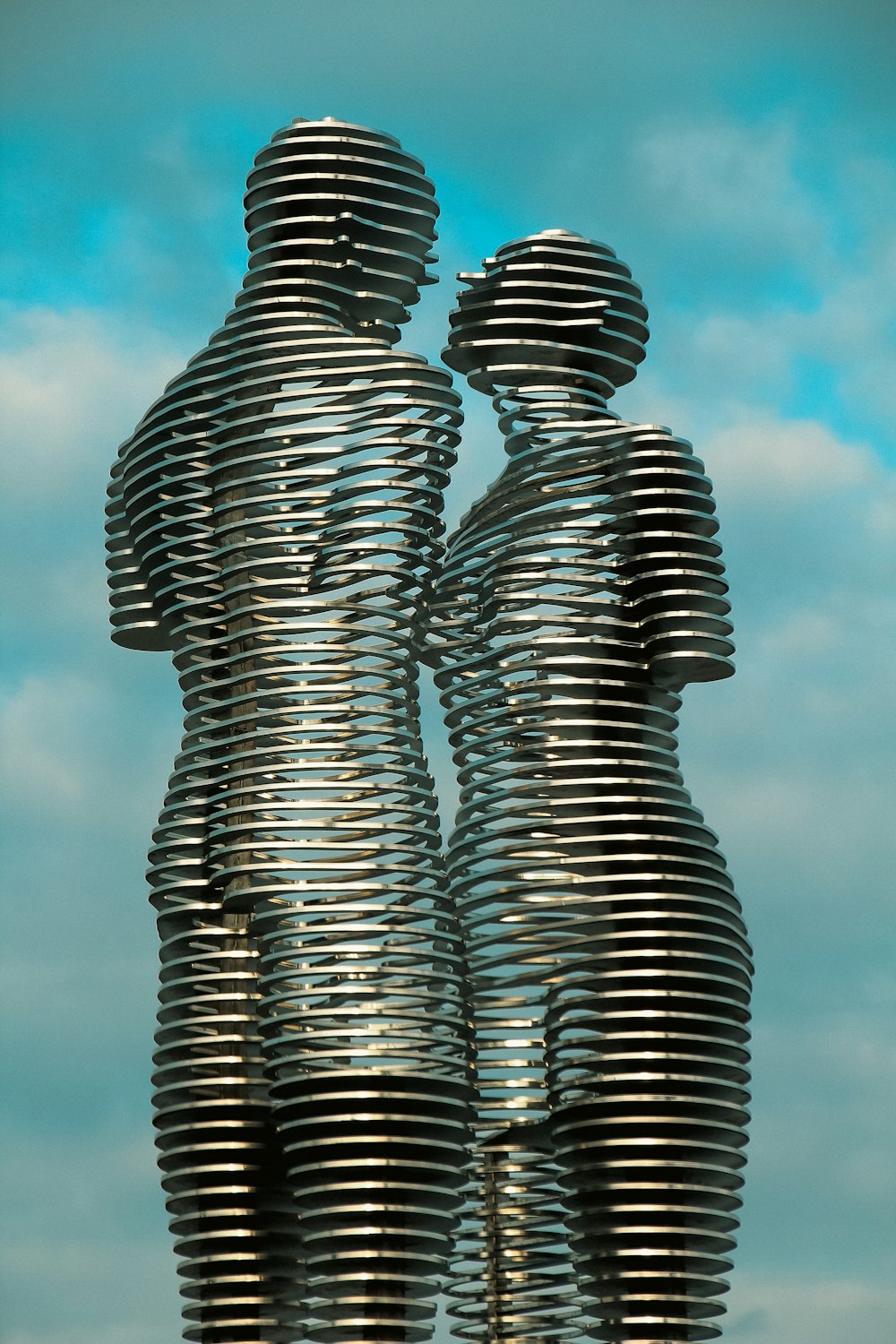 a couple of metal figures standing next to each other