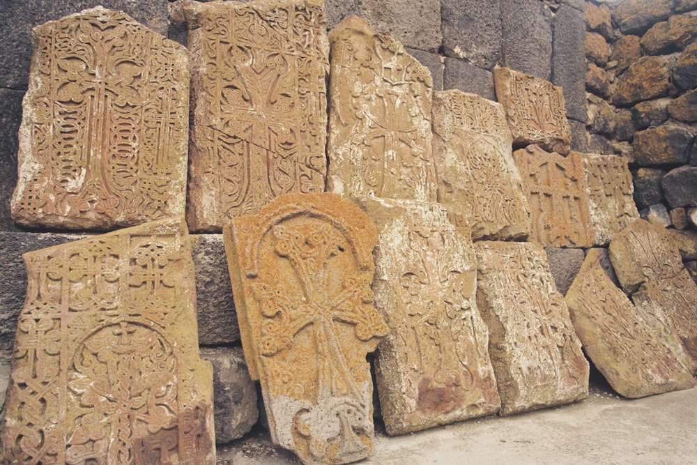 a stone wall with carvings on it