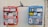 Two colorful mailboxes, one red and the other blue, are mounted on a wall. Both are covered in various stickers and graffiti. Above the mailboxes is a piece of street art depicting a leaping person with a black hat and blue face paint.