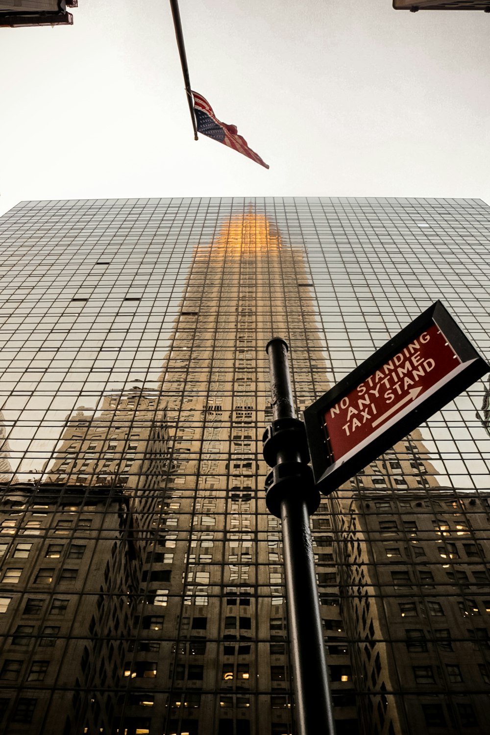 a street sign in front of a tall building