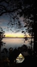 View of the lake from the cabin's porch at sunset.