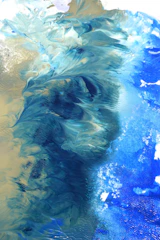 Abstract acrylic painting with swirling blues and greens creating a sense of movement.