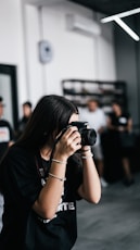 a woman taking a picture with a camera