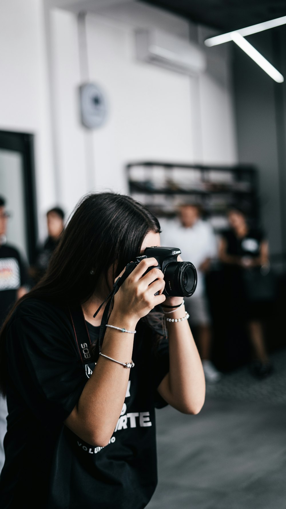 a woman taking a picture with a camera