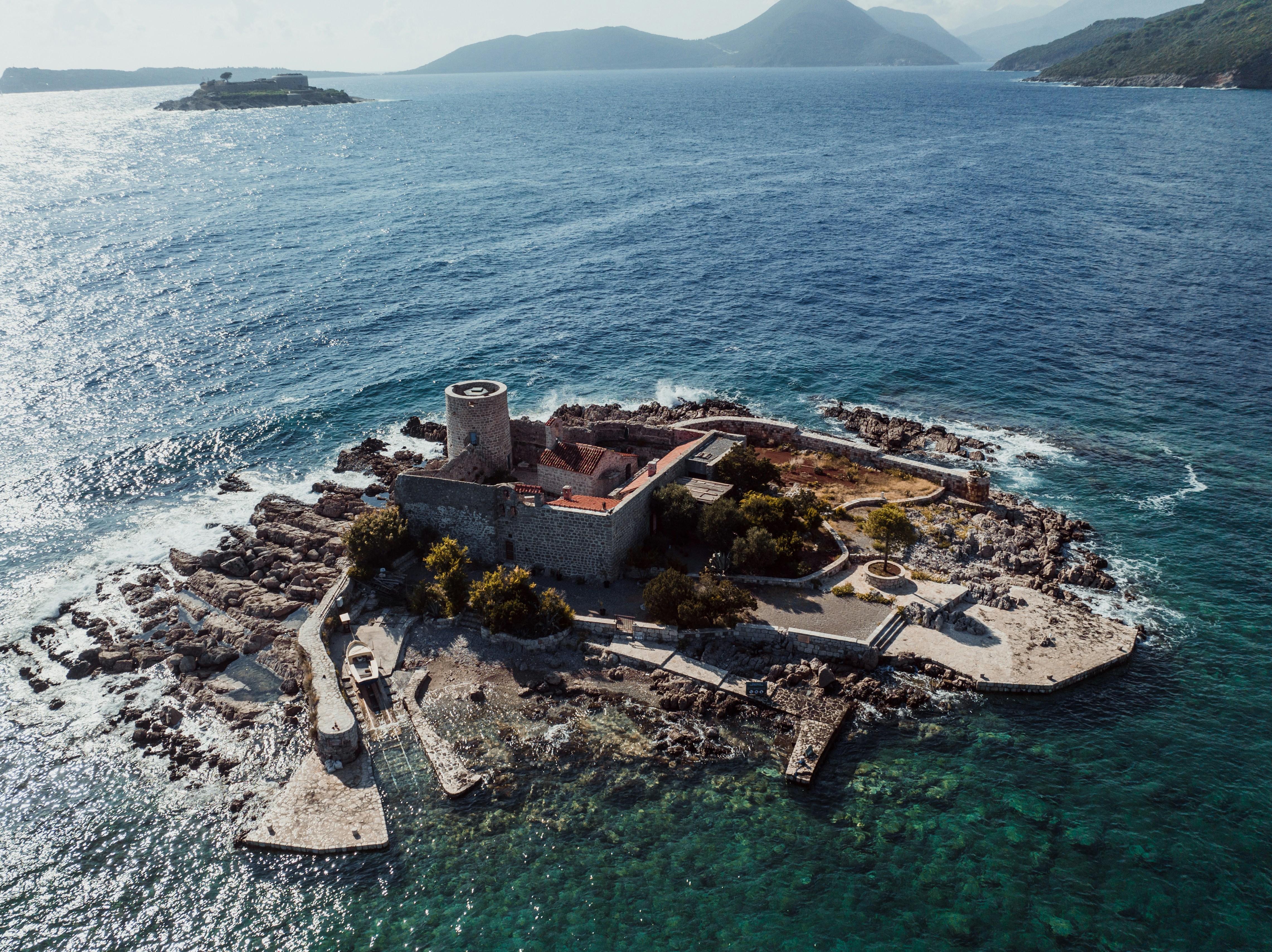 an aerial view of an island in the middle of the ocean