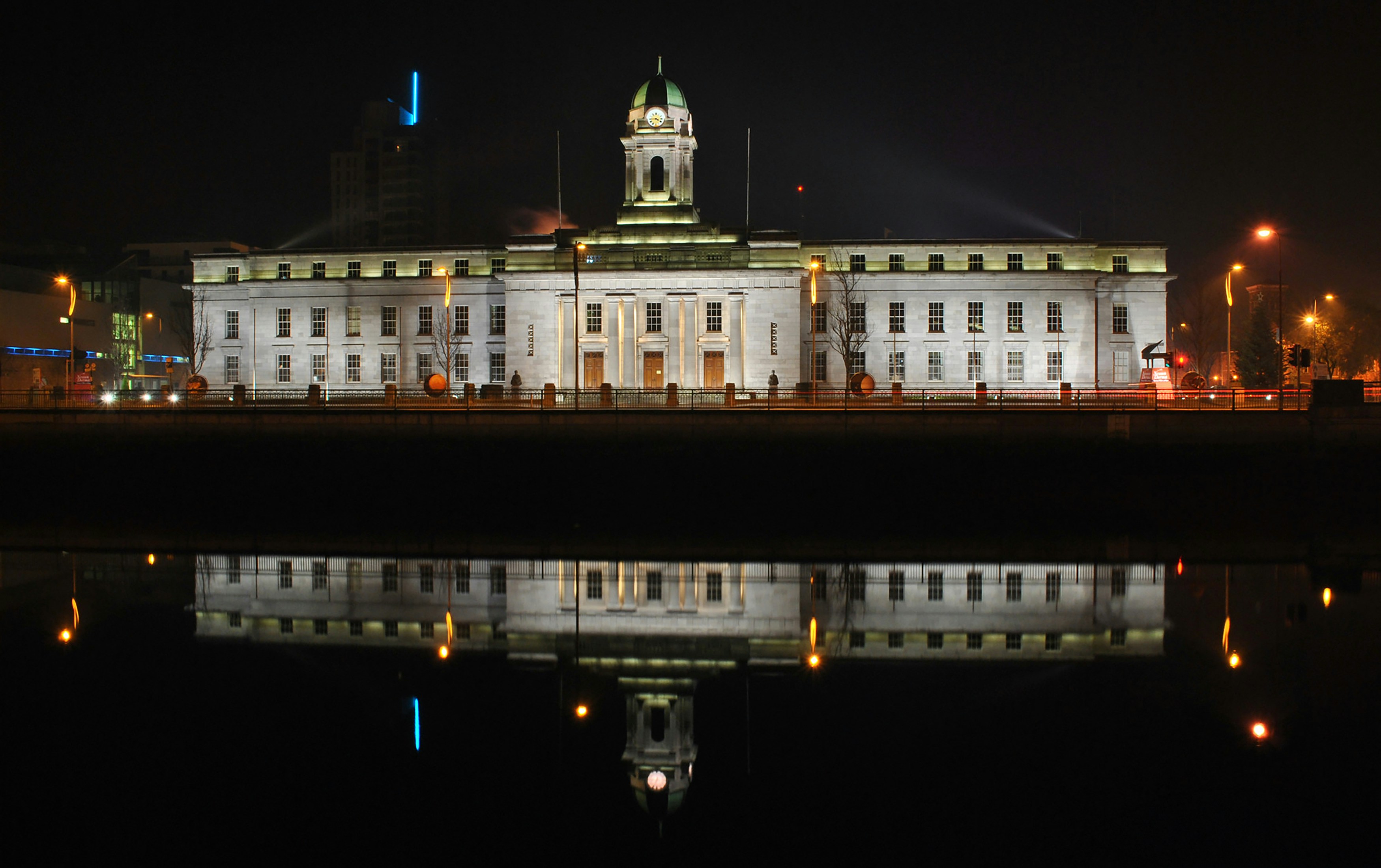 Cork City Hall is reflected in the river Lee, Cork City, Ireland.