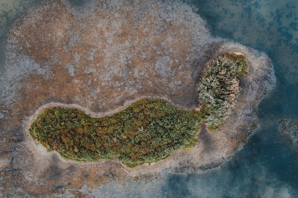 an aerial view of a small island in the middle of the ocean