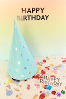 Creative birthday party invitation website with playful graphics and bright colors on a laptop.